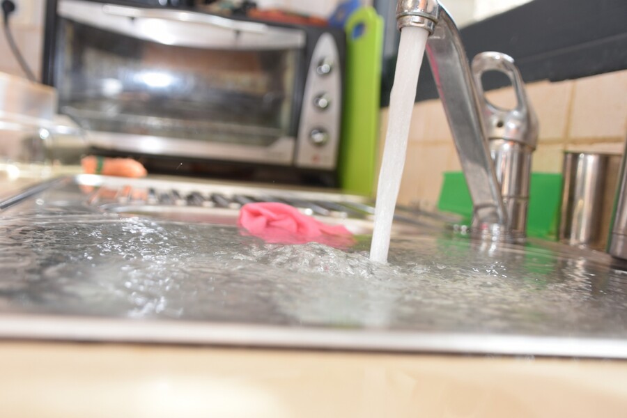 Sink overflowing due to clogged drain ... call Mr. Plumber for drain cleaning.